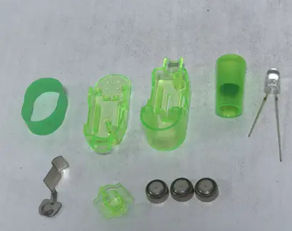 Oitnlaughter Projecting Finger Light Toys Recalled Due to Risk of Serious Injury or Death from Battery Ingestion; Violate Mandatory Standard for Toys; Sold on Amazon by Delightmi: The recalled Oitnlaughter finger lights have three internal button cell batteries that power animal projections, photo 2 of 3