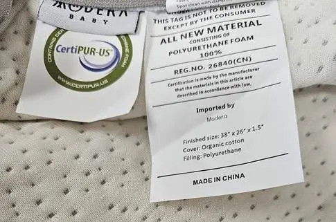 Modera Recalls Modera Pack N Play Mattresses Due to Risk of Serious Injury or Death from Entrapment; Violates Mandatory Standard for Crib Mattresses: Recalled Organic Cotton Pack N Play Mattress Tags, photo 3 of 4