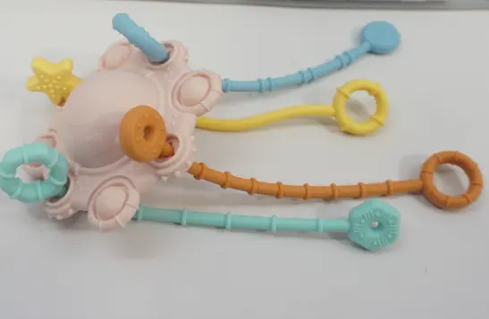 SHEIN Distribution Corporation Recalls Pull and Chew Montessori Teething Toys Due to Risk of Serious Injury or Death from Choking Hazard; Violate Mandatory Standard for Toys: Recalled Pull & Chew Montessori Teething Toy (pink), photo 1 of 3