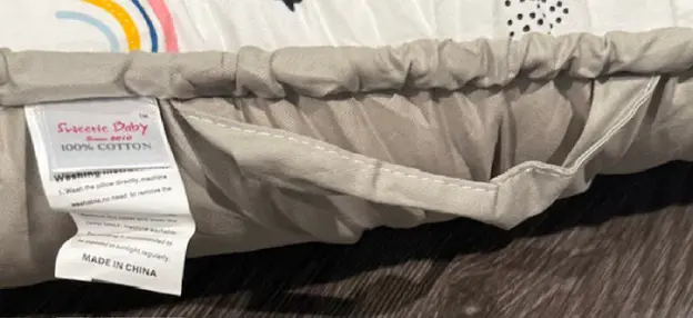 HappyGira Recalls Sweetie Baby and Style Life Eleven Baby Loungers Due to Risk of Serious Injury or Death from Suffocation and Fall Hazards; Violates Mandatory Standard for Infant Sleep Products: Sweetie Baby is printed on a tag on the side of the recalled baby lounger, photo 4 of 4
