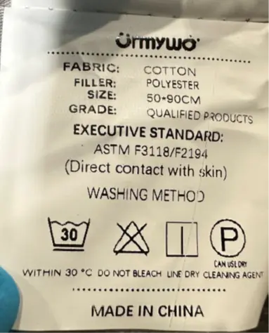 URMYWO Baby Loungers Recalled Due to Risk of Serious Injury or Death from Suffocation and Fall Hazard; Violates Mandatory Standard for Infant Sleep Products; Sold on Amazon by Pomona: Label with "URMYWO" brand name on side of recalled baby lounger, photo 3 of 3