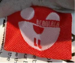Bearlala Baby Loungers Recalled Due to Risk of Serious Injury or Death from Entrapment and Fall Hazards; Violates Mandatory Standard for Infant Sleep Products; Sold on Walmart.com by Nuoxuann: "Bearlala" is printed on an attached label on the outside of the recalled baby lounger's cover, photo 3 of 3