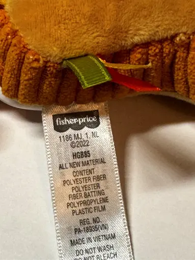 Fisher-Price Recalls Brunch & Go Stroller Toys Due to Choking Hazard: Recalled Brunch & Go Stroller Toy Tag with model number, photo 3 of 3