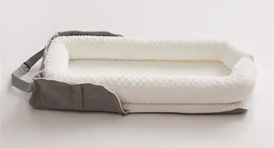 Joyful Journeys Recalls Baby Loungers Due to Risk of Serious Injury or Death from Entrapment and Fall Hazards; Violates Mandatory Standard for Infant Sleep Products: Recalled Joyful Journeys Baby Lounger in white minky, photo 3 of 4